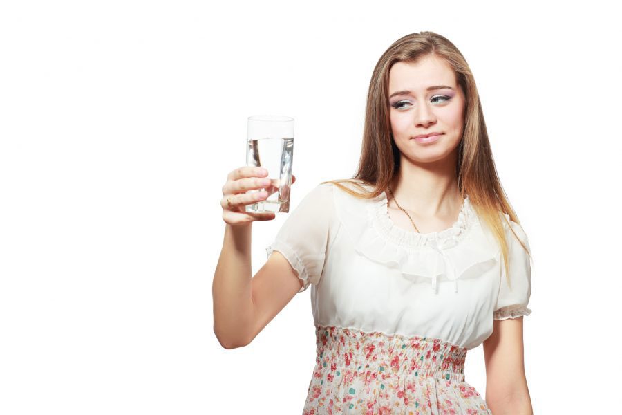 Pinckney Well Drilling & Geothermal | Coastal areas of SC and GA | woman looking skeptically at water in glass